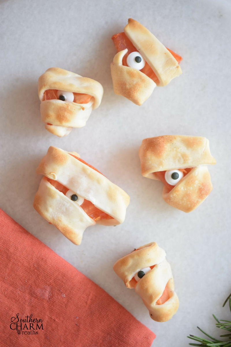 Simple Monster Bites recipe using puff pastry and tomatoes for a spooktacular treat this Halloween. www.southerncharmwreaths.com/blog