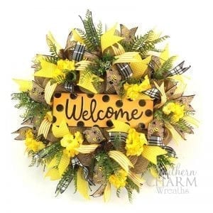 black, yellow, and burlap wreath with welcome sign