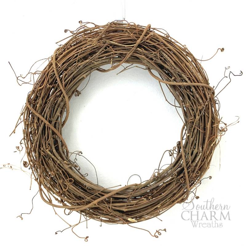 brown grapevine wreath on white background