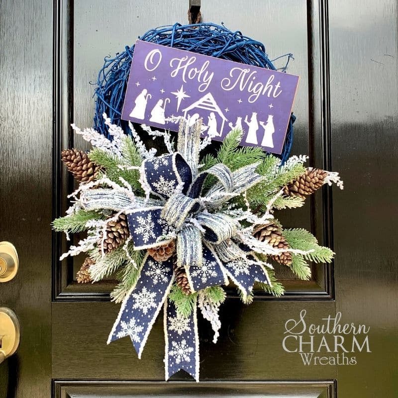 Blue christmas wreath with oh holy night sign