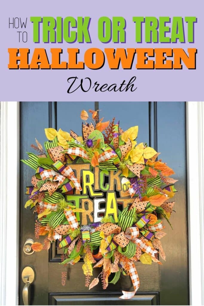 Deco Mesh Halloween wreath on front door with trick or treat sign