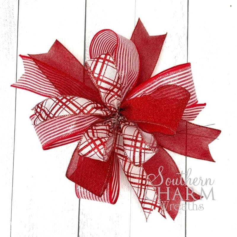 Red and White bow using 3 ribbons