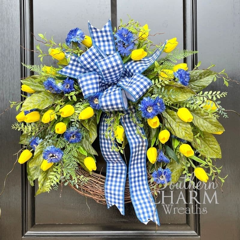 Easy DIY spring tulip wreath hanging on a door 