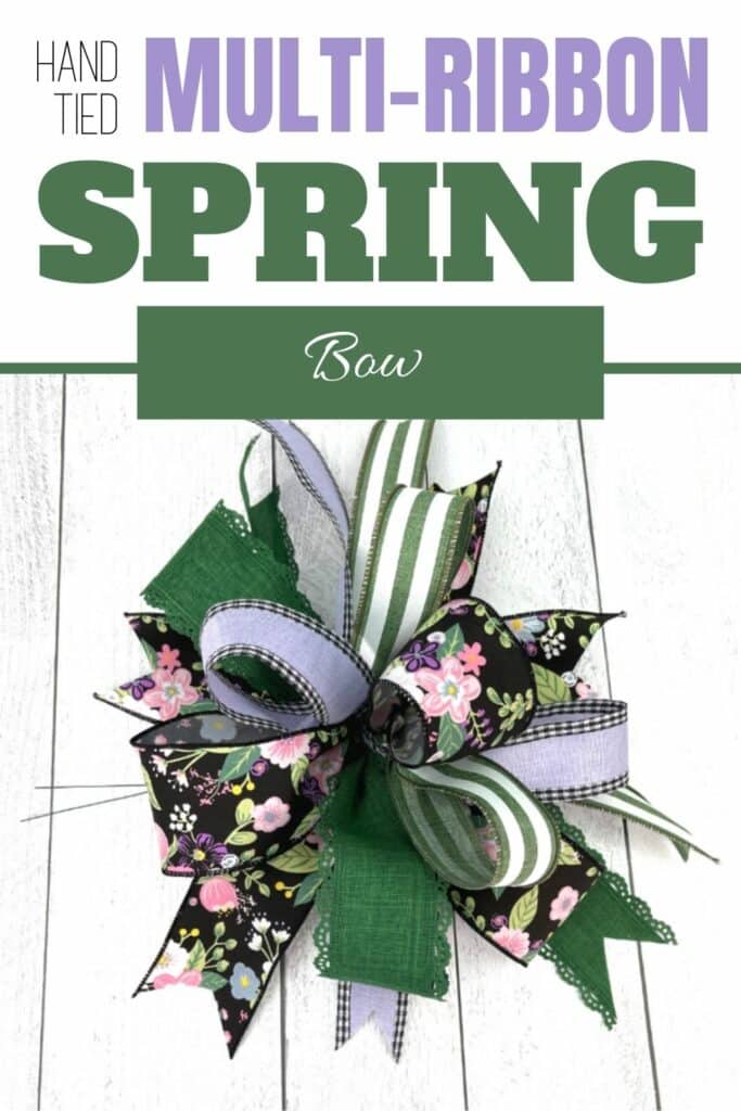 four ribbon bow with green, black, and purple ribbons