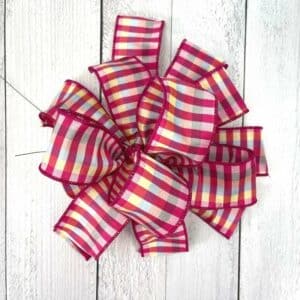 How to make a wreath bow using one ribbon.