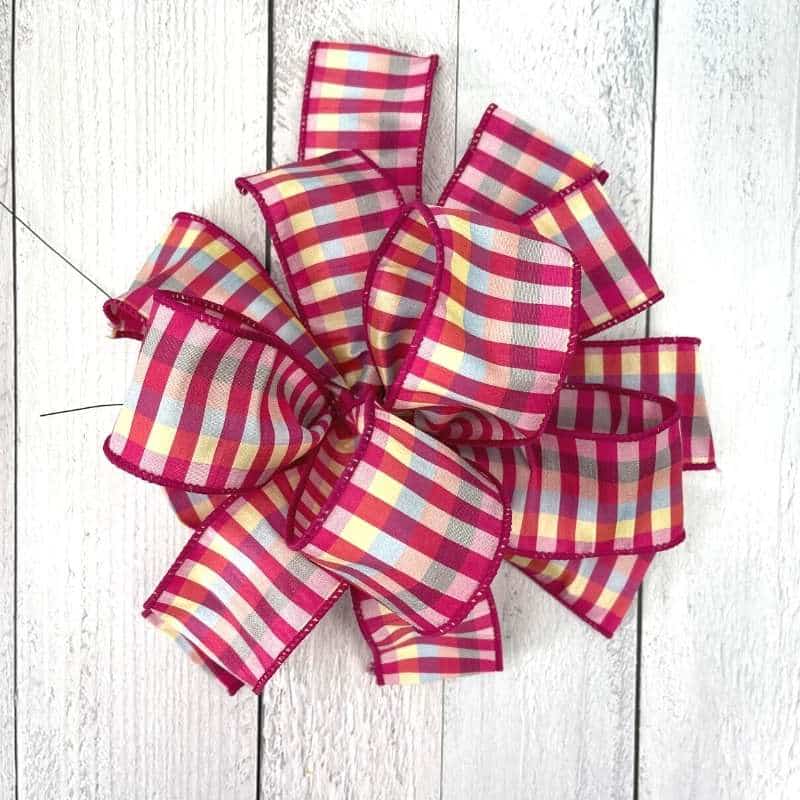How to make a wreath bow using one ribbon.