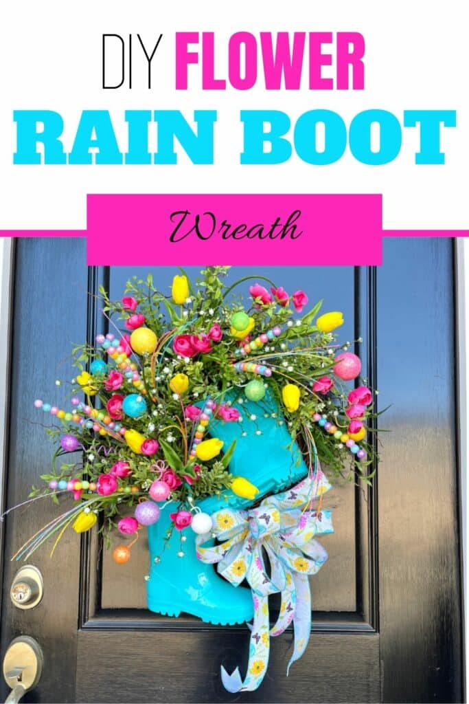 teal wreath with rain boots on black door