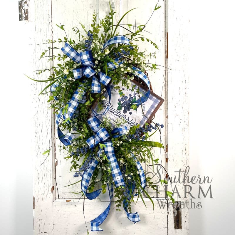 blueberry theme wreath on grapevine with blue checkered ribbon