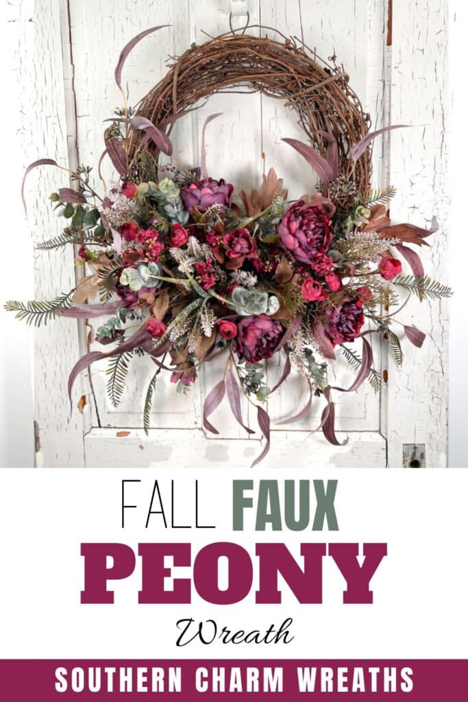 burgundy peony grapevine wreath on white door