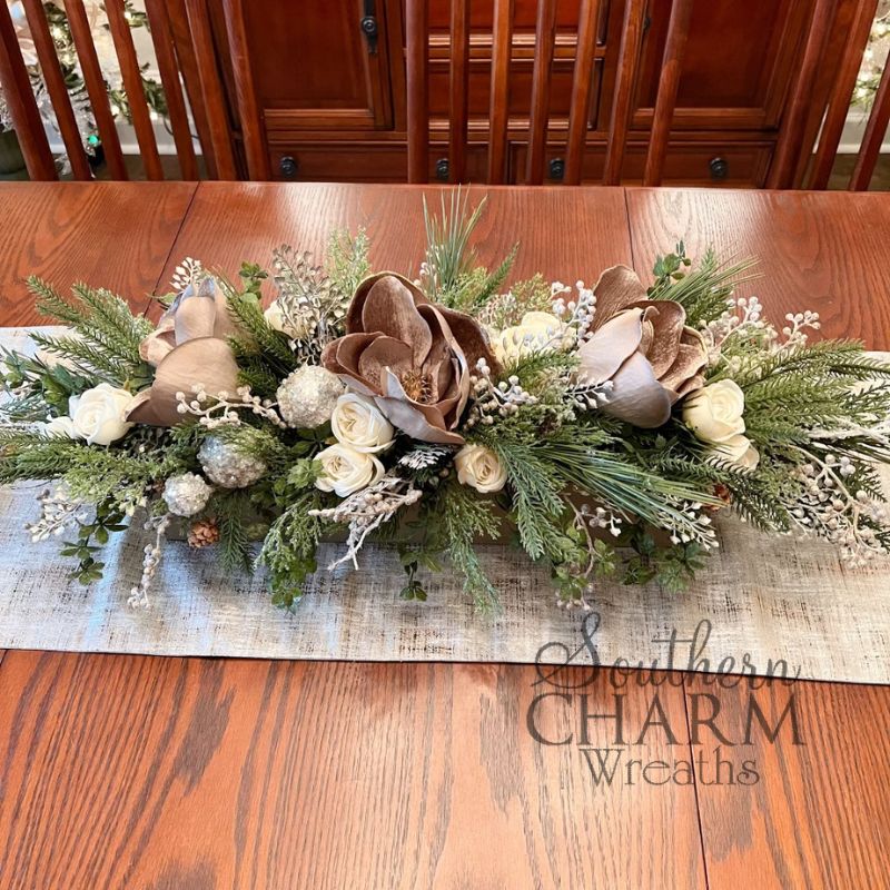 taupe holiday magnolia long table centerpiece on table