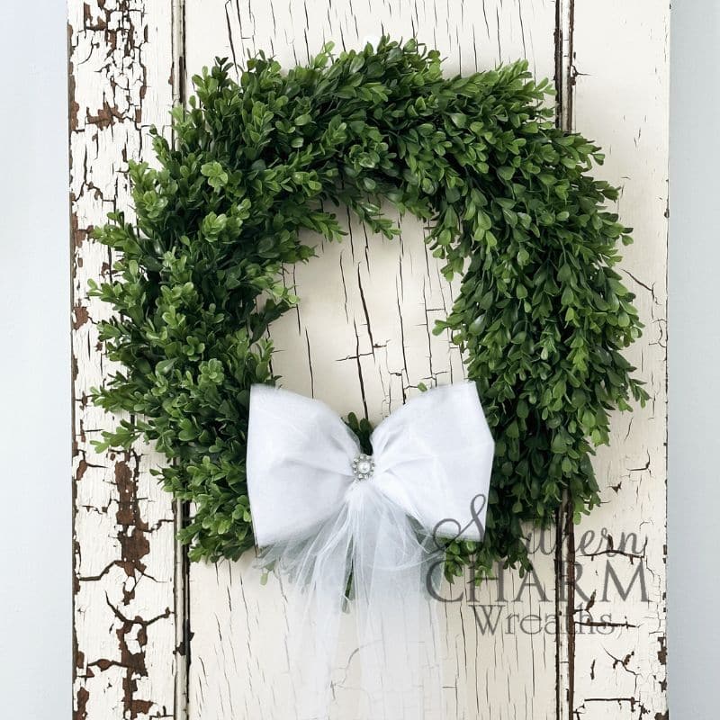 boxwood wedding wreath on white door