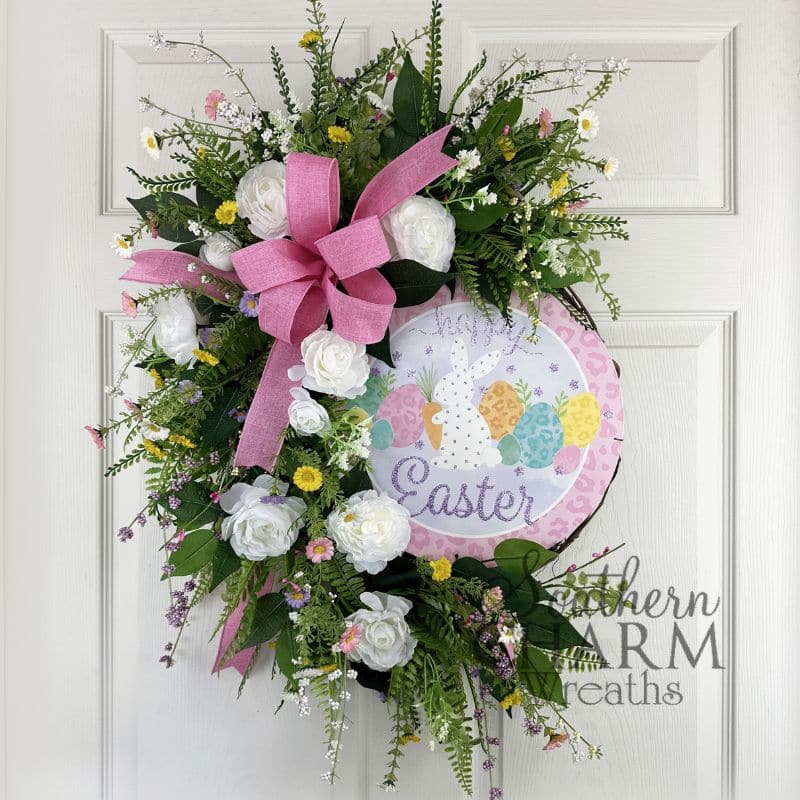 happy easter grapevine wreath on white door
