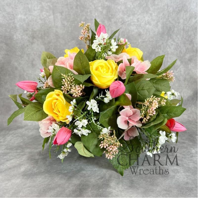 round rose lemonade inspired arrangement on gray background