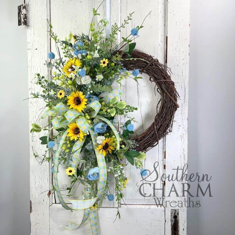 summer blue and yellow sunflower wreath on white door