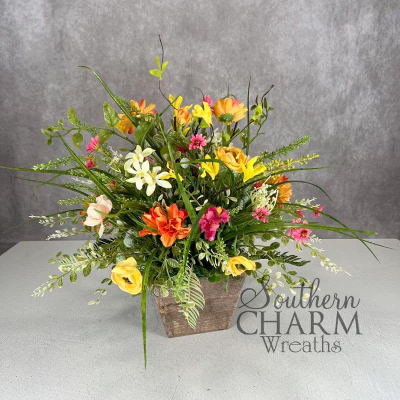 peach blossom arrangement with gray background