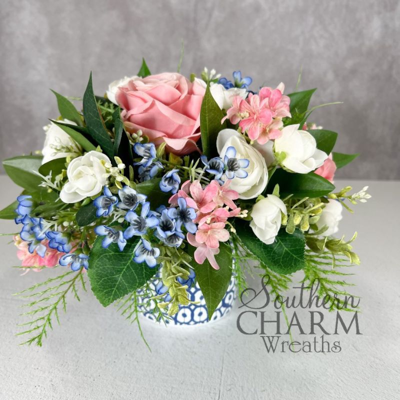 flower arrangement in blue and white coffee mug