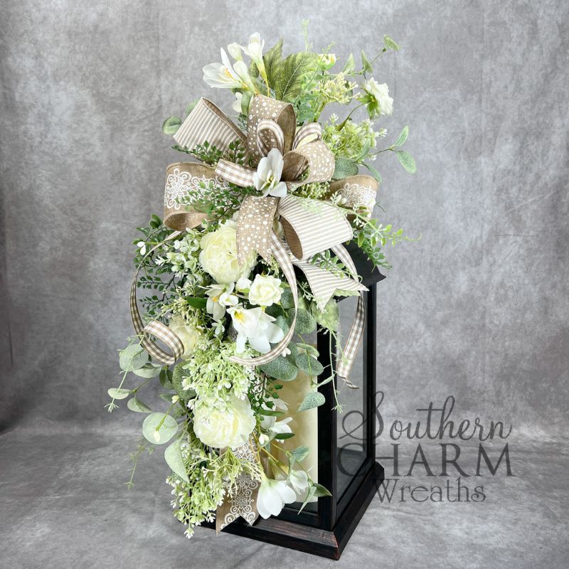 green and beige color wedding themed lantern topper on black lantern