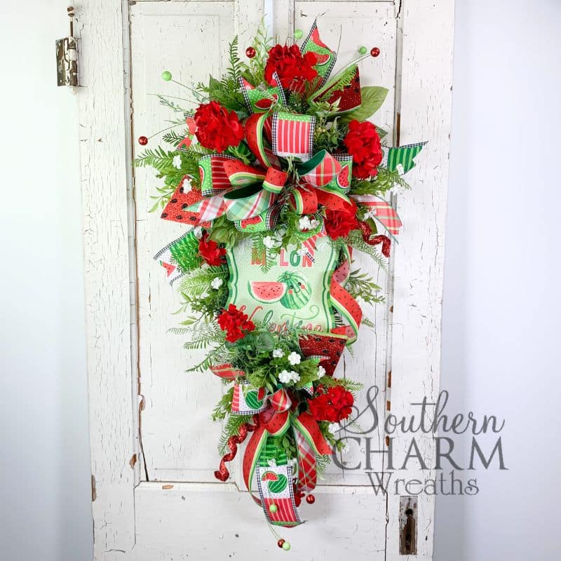 watermelon themed summer swag wreath on white door