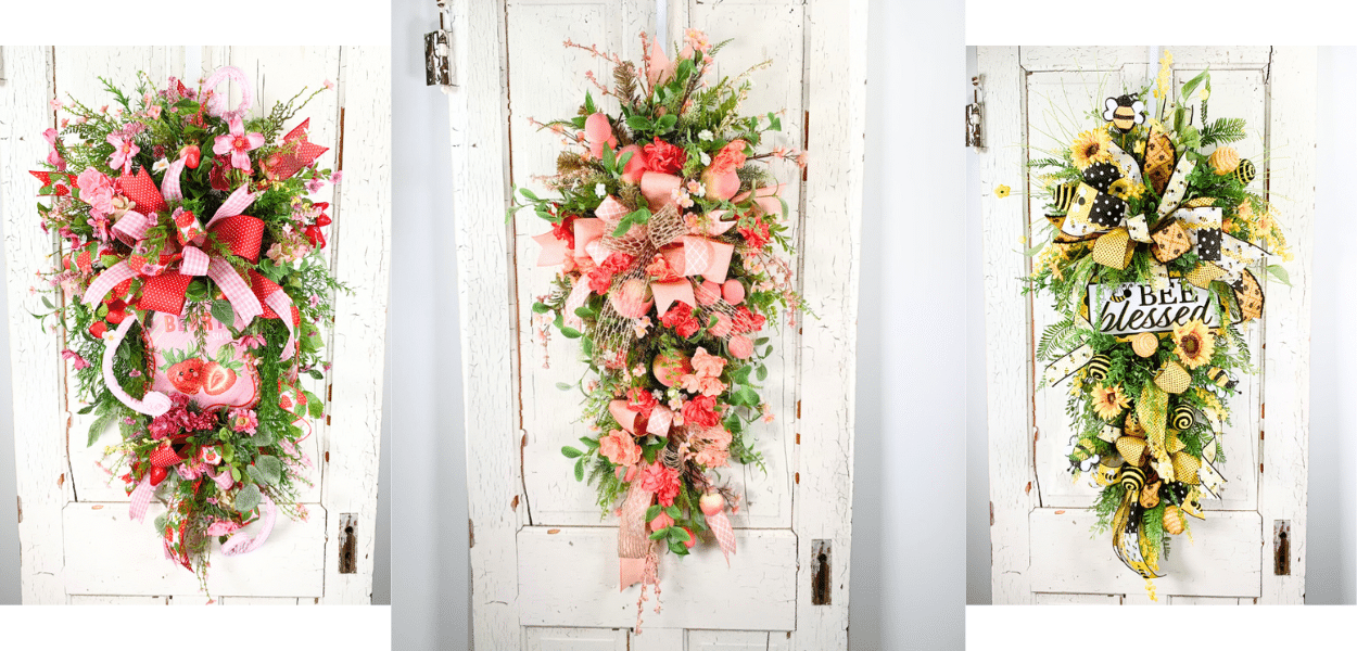 three summer themed swags on white doors