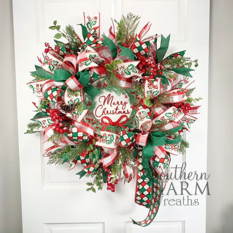 deco mesh christmas holly wreath on white door
