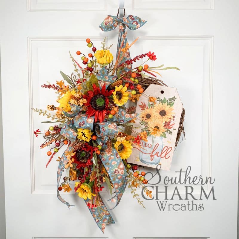 hello fall grapevine wreath on white door