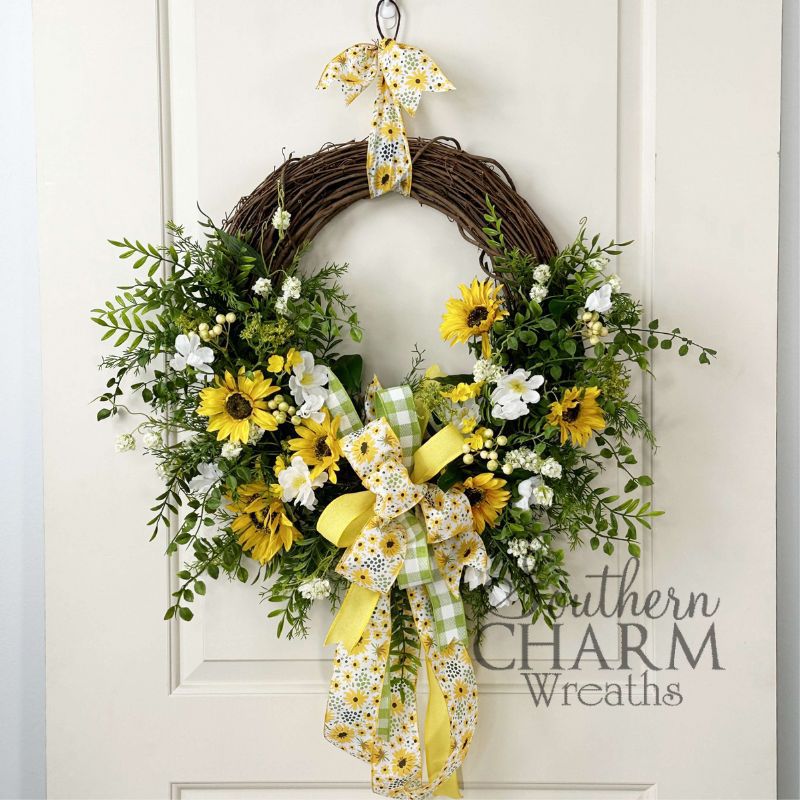 summer sunflower grapevine wreath on white door