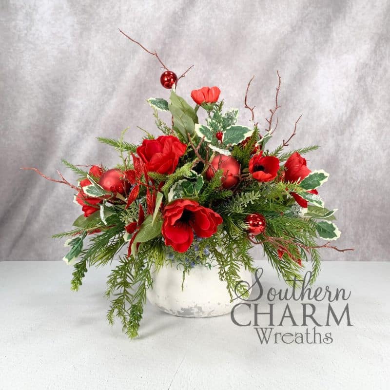 holiday arrangement using silk flowers in red and green