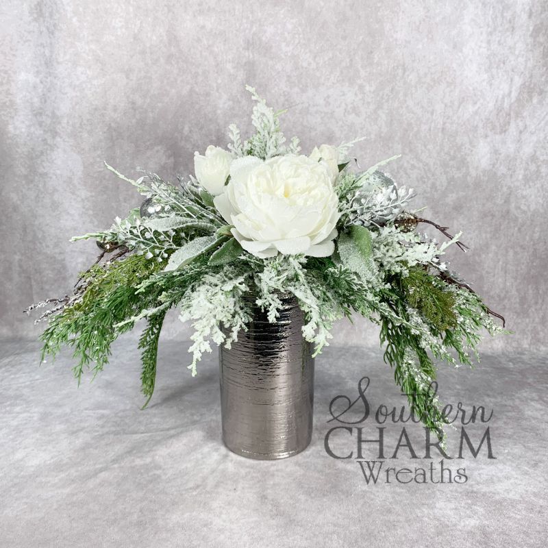 white and silver snowy greenery flower arrangement for Christmas