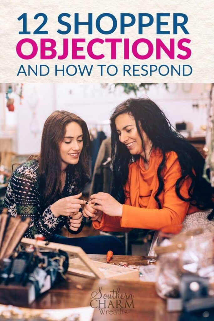 A craft show shop owner talking to a customer.
