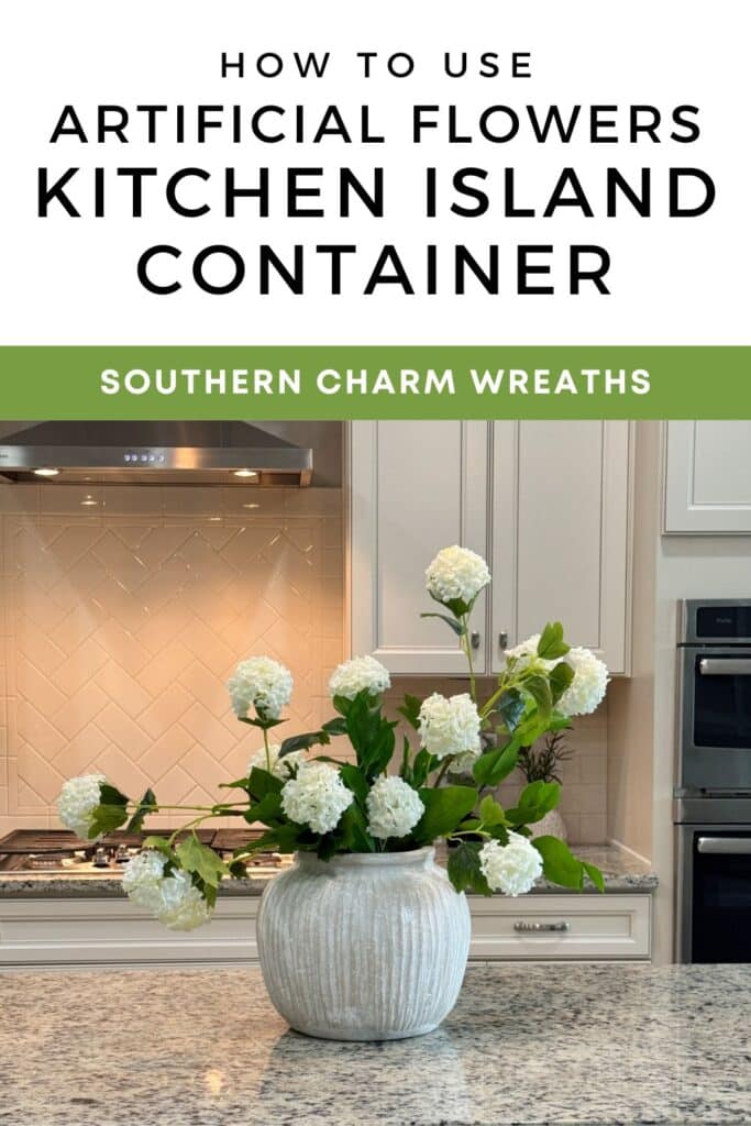 Artificial flower arrangement in a round ceramic container displayed on a kitchen island with text overlay reading How to Use Artificial Flowers Kitchen Island Container.