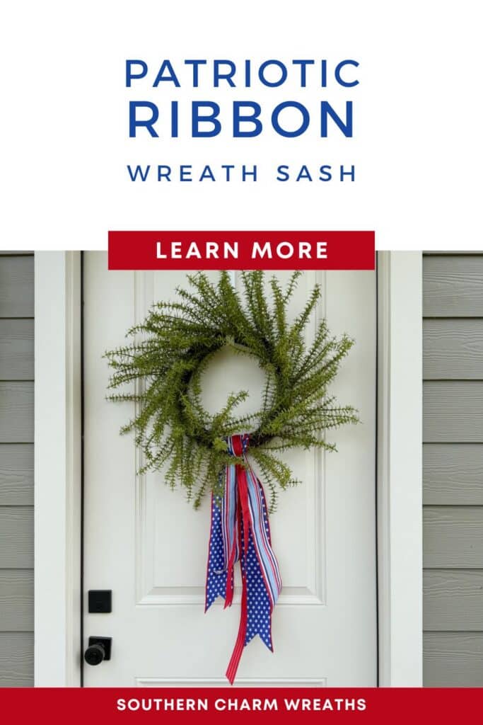 A full green fern wreath hanging on a white paneled front door with gray siding. A patriotic ribbon wreath sash made from three layered wired ribbons — navy blue with white stars, red and white stripe, and light blue and white stripe — is attached at the bottom center of the wreath and drapes in flowing tails below the base. White text header above reads: Patriotic Ribbon Wreath Sash in navy. A red brand bar reads: Southern Charm Wreaths in white.
