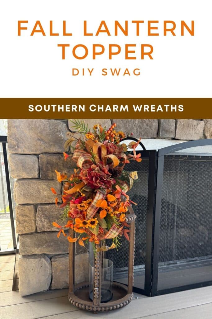 Fall lantern topper on a tall wood beaded lantern next to a stone fireplace, made with silk hydrangeas, sunflowers, orange leaves, berries, pine cone, and plaid ribbon streamers.