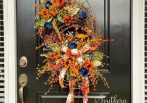 Fall Navy Pumpkin wreath on Divided Grapevine on black door by Southern Charm Wreaths