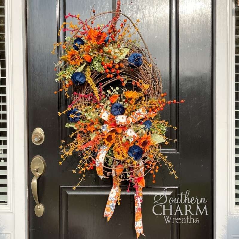 Fall Navy Pumpkin wreath on Divided Grapevine on black door by Southern Charm Wreaths