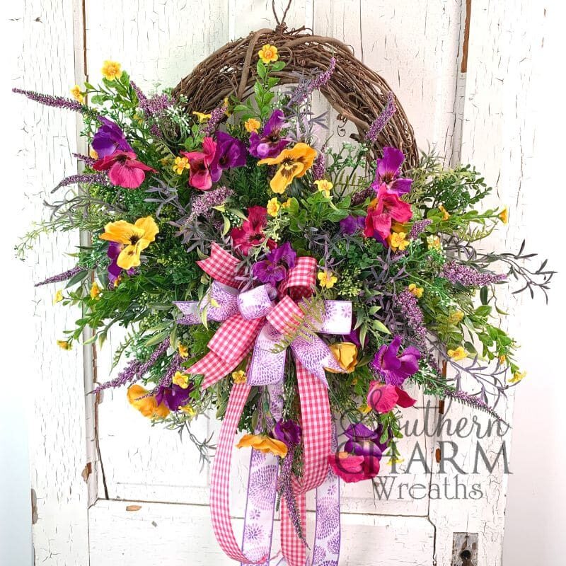 spring pansy grapevine wreath on white door