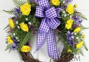 purple and yellow spring summer grapevine wreath on white door
