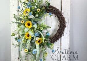 summer blue and yellow sunflower wreath on white door