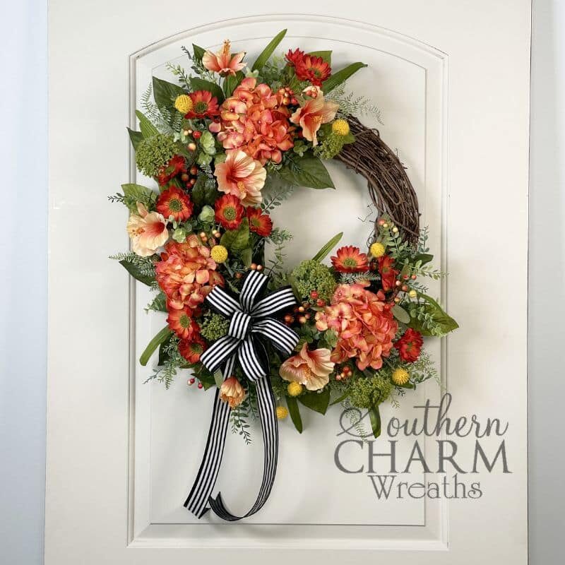 coral hydrangea grapevine wreath on white door
