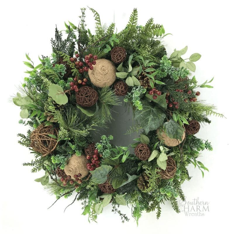 DIY Lush Winter Wreath Idea for Front Door using artificial greenery, pine cones and ornaments.