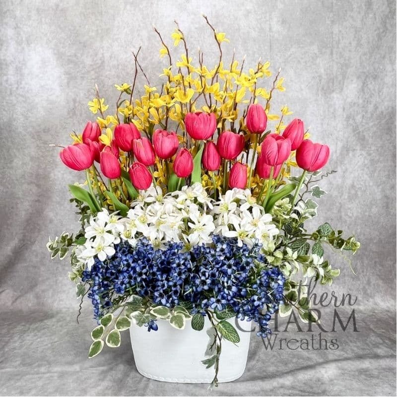 spring hedge floral arrangement on gray background