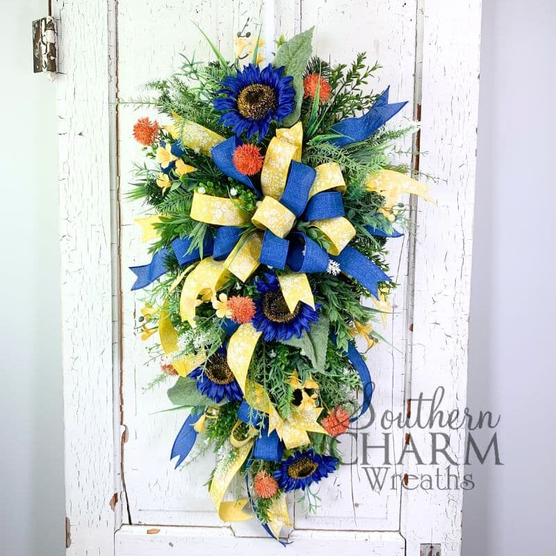 blue sunflower summer swag wreath on white door