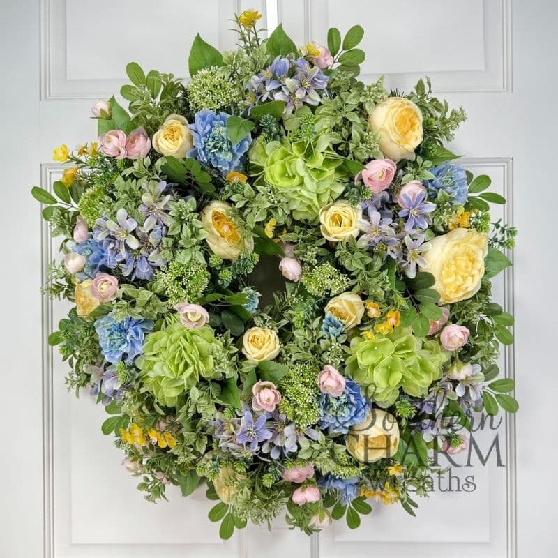 spring wreath on an evergreen wreath base